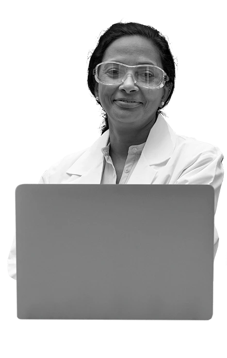 Image of Lab Technician smiling in front of laptop