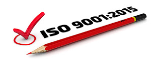 text saying ISO 9001:2015, with pencil and checkmark
