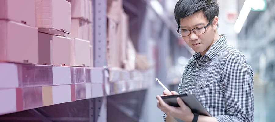 Young Asian person worker doing stocktaking of pharma supplier management