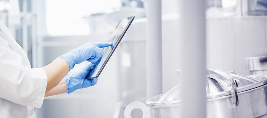 Pharma contract manufacturing professional uses tablet