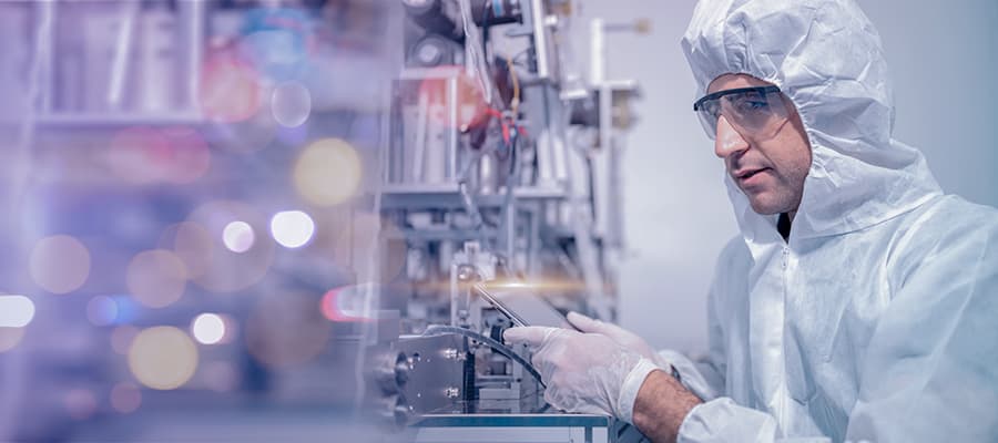 Medtech scientist wearing protective clothing Inspect mask making machines in a laboratory at an industrial plant. Anti-virus production warehouse. concept of safety and prevention coronavirus covid-19.